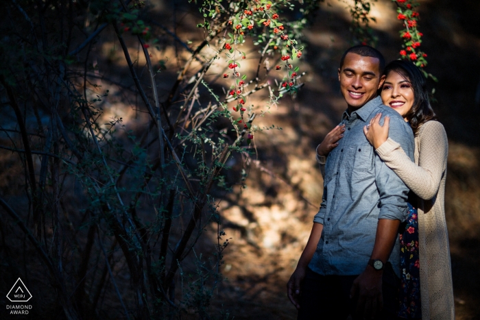 Photo by: <a href="https://www.wpja.com/photos/diamond-award-top-wedding-engagement-photographer/2551946">Chris Shum - Sunnyvale California Engagement Photos from Oakland Hill - Couple enjoying the warm sunlight in the woods