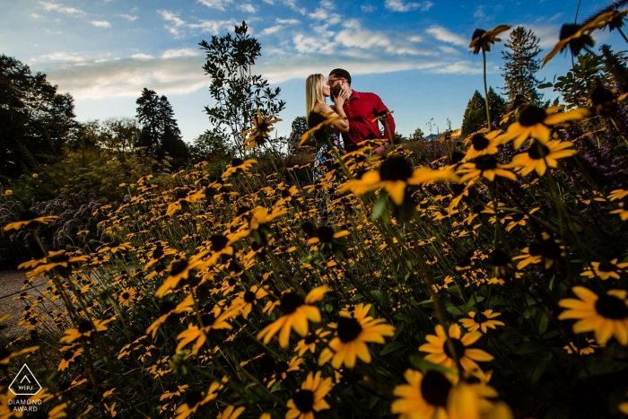 Photo by: <a href="https://www.wpja.com/photos/diamond-award-top-wedding-engagement-photographer/2551995">Miguel Gonzalez - Abington Pennsylvania Engagement Photos from Philadelphia - Longwood Gardens - "I was looking for color, saw the flowers contorted myself and got the shot." -Photographer