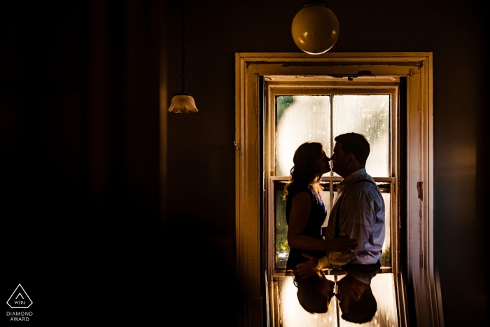 Engagement Photography for Manhattan - NYC Portrait: Steinway Couple's photo by the window 