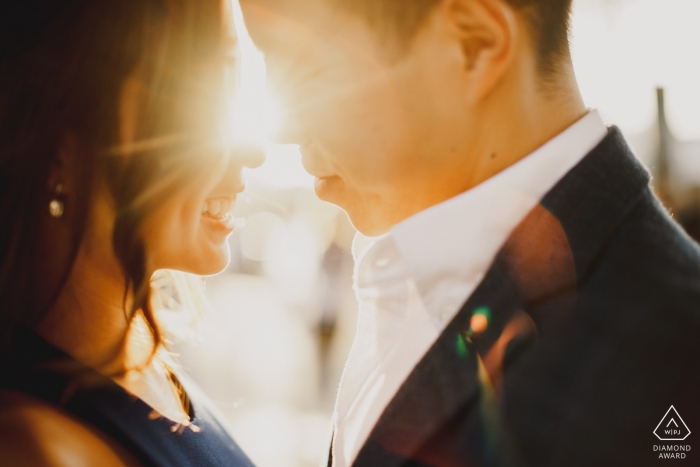 London - Soon-to-be Bride and groom kissing in the sun 