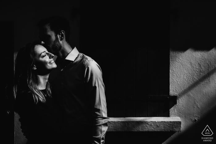 Photo by: <a href="https://www.wpja.com/photos/diamond-award-top-wedding-engagement-photographer/2554779">Sylvain Garderes - Beost Biarritz, France B/W Engagement Photos : Couple kissing in a street of Biarritz