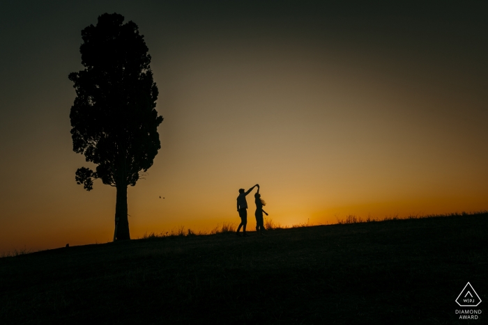 Tuscany, Siena Couple Dancing at sunset during engagement portrait session