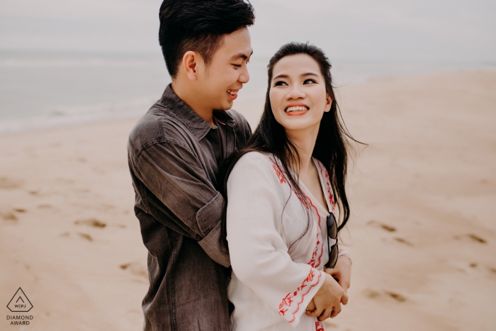 Ho Coc Engagement Photo showing a Couple having a nice time together in the sand at the beach Ho Coc Engagement Photography - Couple having a nice time together in the sand at the beach