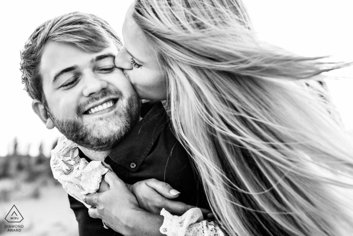 Avalon, New Jersey engagement session in black and white with wind and hair blowing