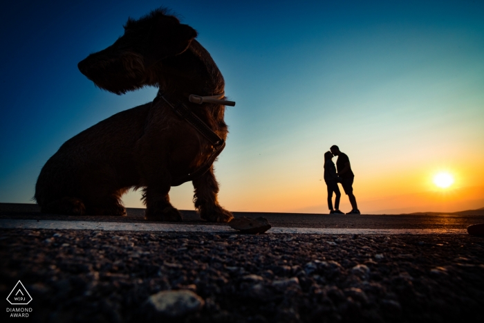 Photo by: <a href="https://www.wpja.com/photos/diamond-award-top-wedding-engagement-photographer/2556829">Antonio Calatayud - La Eliana Valencia Arcos de las Salinas Engagement shoot at sunset with a dog