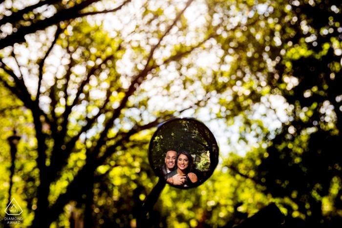 Chicago, IL Engagement session using a motorcycle mirror in the trees