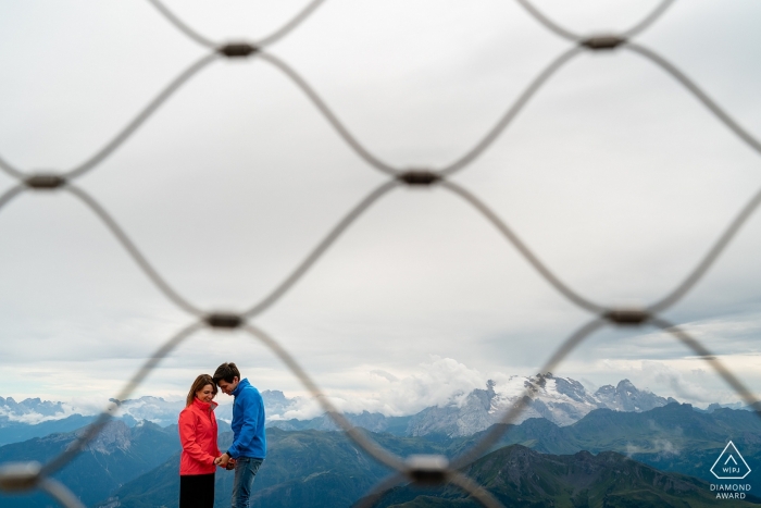 Engagement portraits outdoors above Dolomites, Italy 