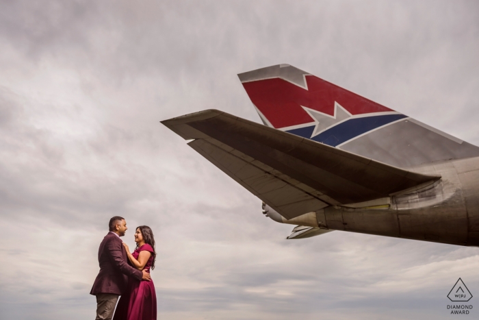 Photo by: <a href="https://www.wpja.com/photos/diamond-award-top-wedding-engagement-photographer/2559694">Jay Hoque - Uxbridge London Engagement Portrait Session at the Cotswald Airport, UK with tail of airplane