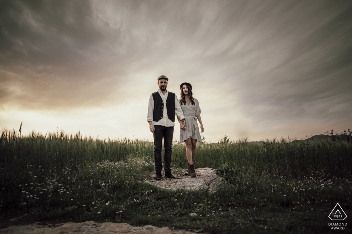 Photo by: <a href="https://www.wpja.com/photos/diamond-award-top-wedding-engagement-photographer/2560048">Emre Nesli - İstanbul Istanbul Couple standing on a rock with an interesting sky behind them in Mersin Turkey