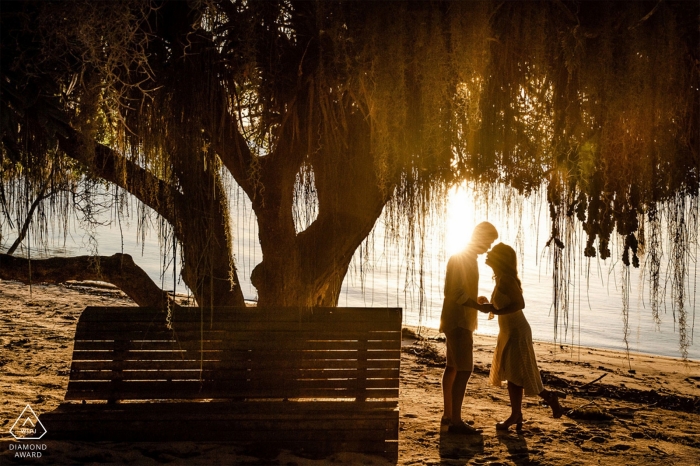 Linhares, Espírito Santo, Brazil pre wedding portrait at the water during sunset.