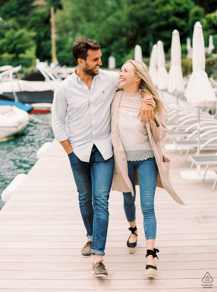 Photo by: <a href="https://www.wpja.com/photos/diamond-award-top-wedding-engagement-photographer/2561351">Sylvain Bouzat - Lyon Annecy, French Alps - A couple walk near the lake in Annecy