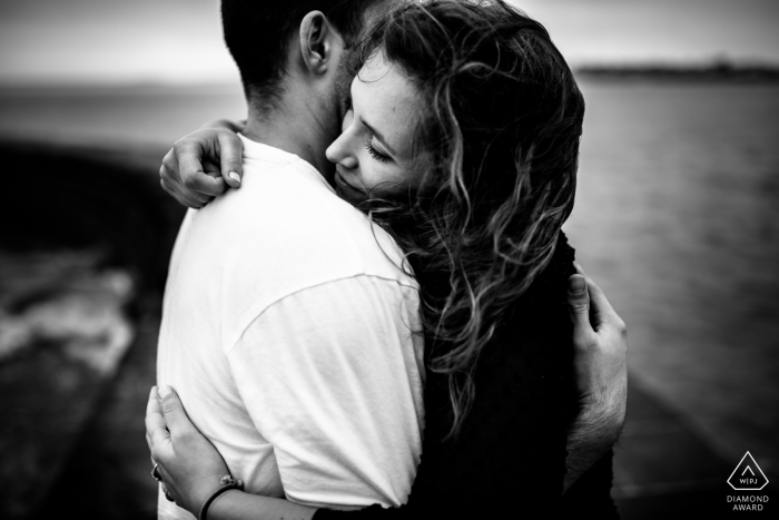 Photo by: <a href="https://www.wpja.com/photos/diamond-award-top-wedding-engagement-photographer/2562632">Charline Eberhardt - Paris Quimiac (Brittany, France) Intensity - Black and White Intimate Couple Portrait at the Water