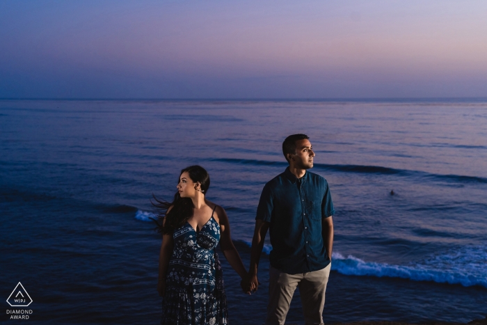 San Diego, Ca engagement shoot session | Couple lit creatively in front of the ocean background 