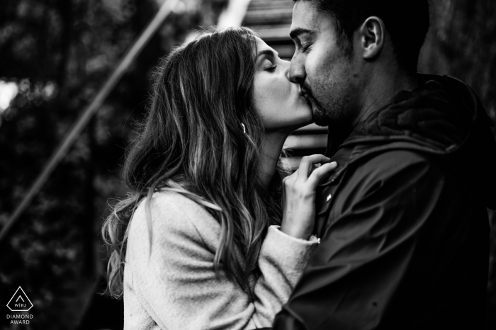 Agen, France black and white couple kissing portrait.