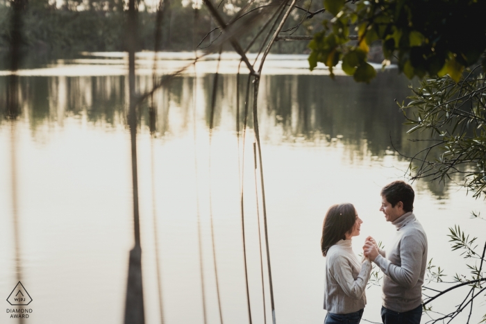 Photo by: <a href="https://www.wpja.com/photos/diamond-award-top-wedding-engagement-photographer/2563390">Federica Ariemma - Napoli Napoli Naples wedding photographer image of an engaged couple holding hands by a lake