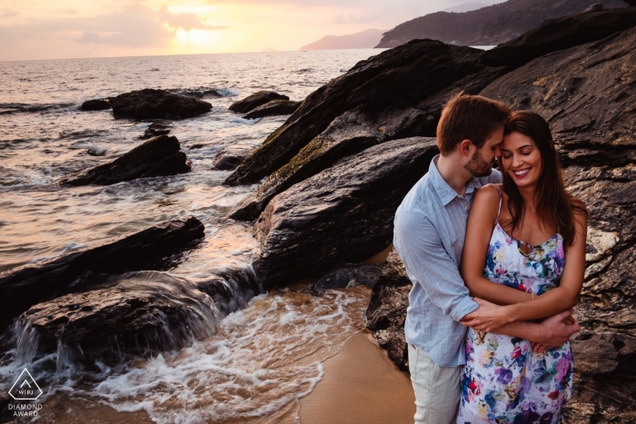 Photo by: <a href="https://www.wpja.com/photos/diamond-award-top-wedding-engagement-photographer/2563516">Vinicius Terror - Ouro Preto Minas Gerais Praia de Toque Toque Pequeno Pre Wedding Sunset Shoot at the Beach with Rocks and Waves.