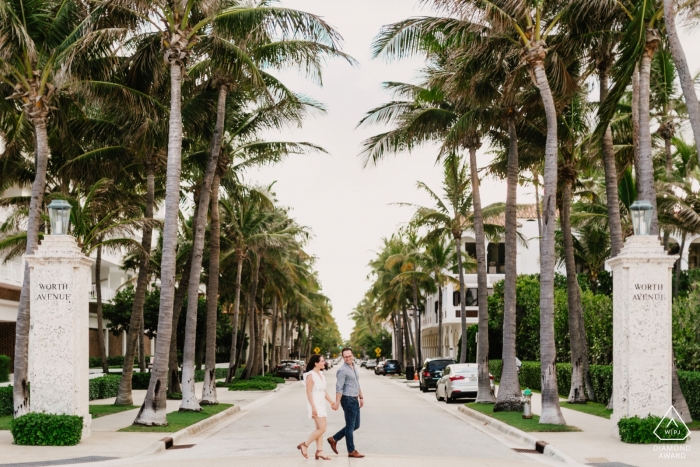 Couple walking down Worth Ave in Palm Beach, FL | Engagement Photography