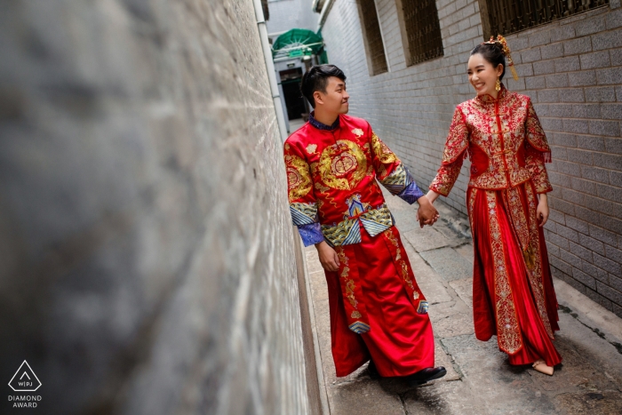 Photo by: <a href="https://www.wpja.com/photos/diamond-award-top-wedding-engagement-photographer/2564063">Jacob Gordon - Perth Western Australia Ho Chi Minh City couple Walking and laughing together for pre wedding photos in red attire.