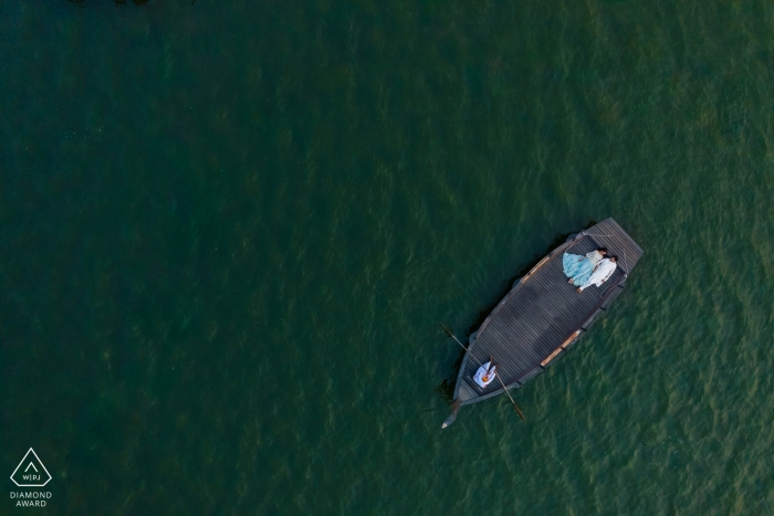 Photo by: <a href="https://www.wpja.com/photos/diamond-award-top-wedding-engagement-photographer/2565760">Ankita Asthana - Mumbai Maharashtra Jaipur, India pre-wedding portraits - India, lakes and love go well together! - Drone photography over the water and boat