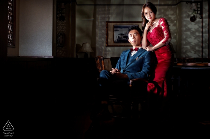 Taiwan, Hualien Engagement Couple Session - Image contains: red, dress, formal, dress, attire, indoors