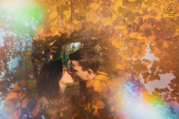 Vittel, France Automnal engagement portrait - Photo Session - Portrait contains: leaves, fall, colors, rainbow, prism, kiss