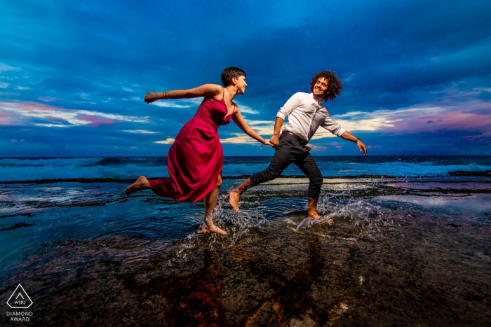 Engagement Photo Session with a couple Running at the beach together Tunel Guajataca, Isabela PR Engagement Photo Session - Image contains: Running at the beach together