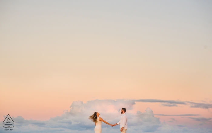 Alagoas, Brazil Engagement Photography - Image contains: pastel, sky, clouds, flying, floating