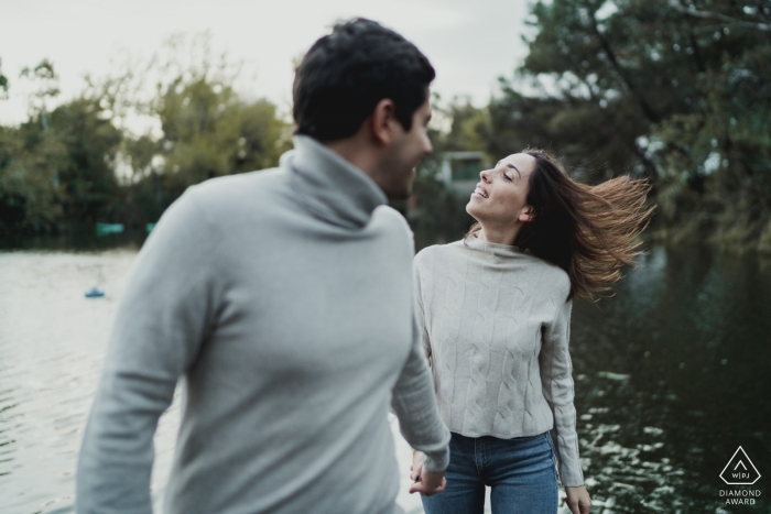 Naples, Italy Engagement Couple Session - Image contains: water, lake, hair, flying