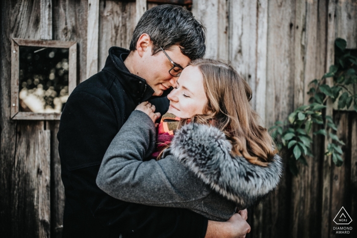 Photo by: <a href="https://www.wpja.com/photos/diamond-award-top-wedding-engagement-photographer/2567272">Martin Hecht - Göppingen Baden-Württemberg Hohenstaufen Engagement Portrait of a Couple - Image contains: hug, embrace, winter, jackets, joy, love