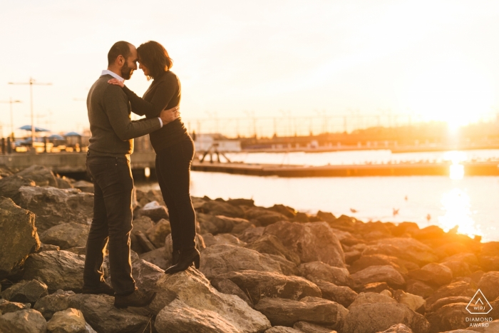 Brooklyn Bridge Park, New York City - Couple pauses for a moment at sunset to think about their relationship. Engagement Photography