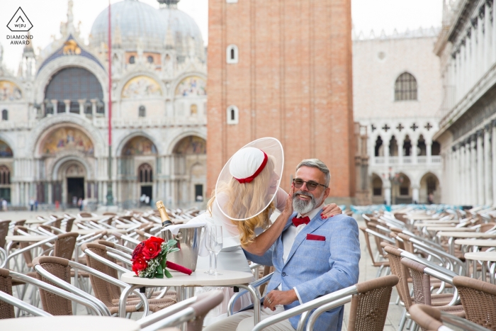 Engagement Portrait of a couple sitting at the Cafe Florian in Piazza San Marco Engagement Portrait of a Couple - Image contains: A couple sitting at the Cafe Florian in Piazza San Marco