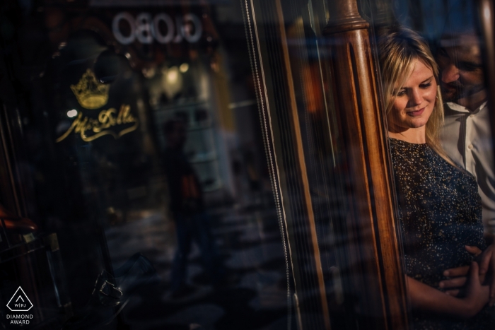 Cascais Engagement Couple Photography - Portrait contains: reflections, embrace, glass, windows