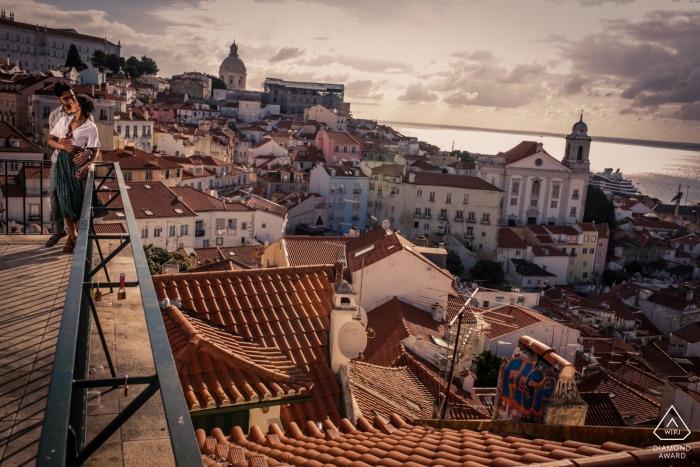 Lisbon, Portugal Engagement Photography with a Tagus River view Lisbon, Portugal Engagement Photography - Image contains: Tagus River, view, roofs, water, sunset