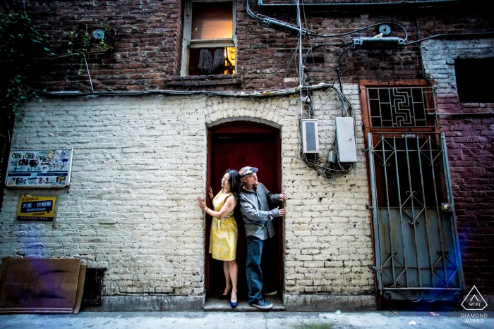 San Francisco, CA engagement Image of a couple in a Chinatown alley. 