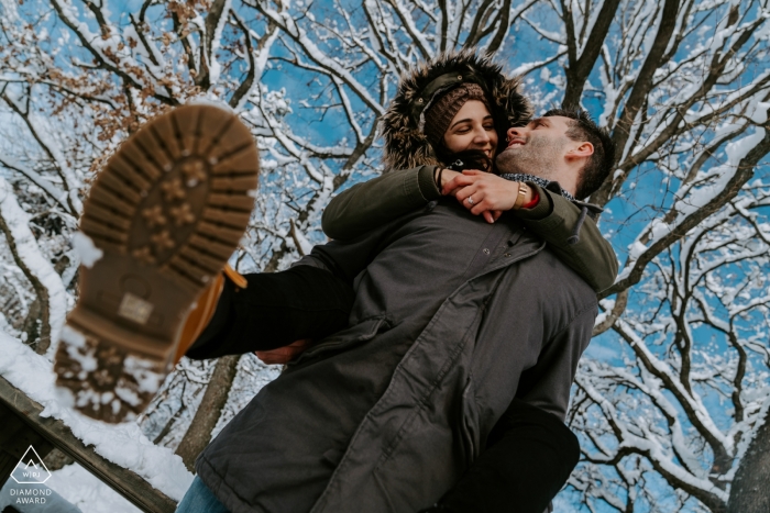 San Marco Mtn. Engagement Picture Session - Portrait contains: snow, trees, piggyback, hug