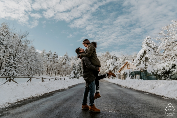 Mt. San Marco Engagement Session Photography - Portrait contient: couple, neige, hiver, chaussée, rue, arbres, nuages