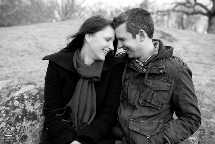 Rhode Island Engagement Portrait Session - Image contains: Couple sitting on rocks, winter, jackets, fall, cold