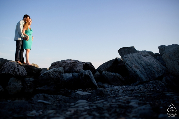 Newport, RI Engagement Photography - Portrait contains: couple standing on rocks