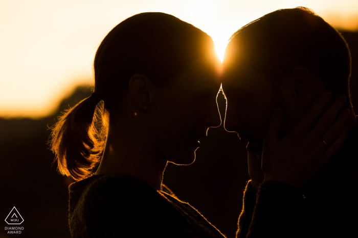 Bir Hakeim Bridge, Paris, France - Silhouette engagement shot of a couple touching heads at sunset in Paris