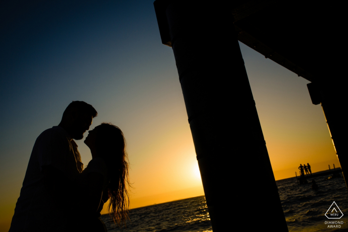 Perth Western Australia - A nice picture at the beach. | Engagement Session Photography - Portrait contains: water, sun, sunset, pier 