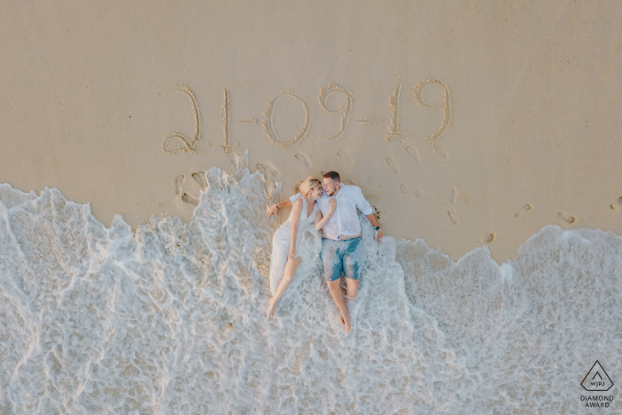 overhead beach Drone Portraits for Engaged Couple with their wedding date Rio de Janeiro - RJ - Brazil Drone Portraits - Engaged Couple: our wedding date