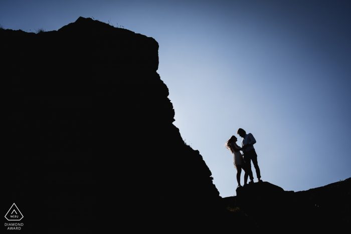 Photo by: <a href="https://www.wpja.com/photos/diamond-award-top-wedding-engagement-photographer/2572077">Patrick Lombaert - Plelan le Petit Crozon, France Couple Silhouettes - Engagement Photography at the Rocks