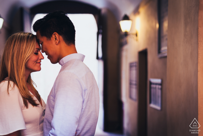 Montepulciano - Tuscany - Italy pre wedding photographer: a romantic moment in Montepulciano with an engaged couple about to kiss