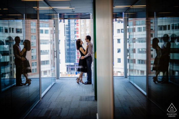 Johns Hopkins Baltimore Campus Couple Portrait - Reflections in glass during photo shoot for engagement pictures.