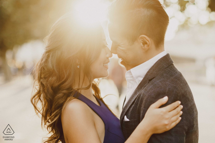 London Couple with sun setting behind them during engagement photoshoot session