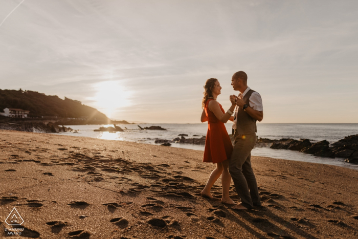 Photo by: <a href="https://www.wpja.com/photos/diamond-award-top-wedding-engagement-photographer/2574611">Julien Marchione - Biarritz Guethary engagement photography - A couple is dancing on the beach