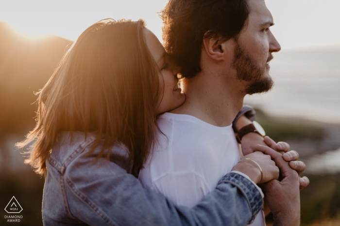 Photo by: <a href="https://www.wpja.com/photos/diamond-award-top-wedding-engagement-photographer/2574618">Julien Marchione - Biarritz Guethary pre wedding portraits - A girl is giving a hug to her future husband