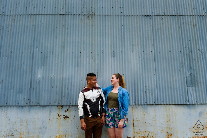 Old Montreal, Quebec Engagement photo against a grey metal wall in Montreal 