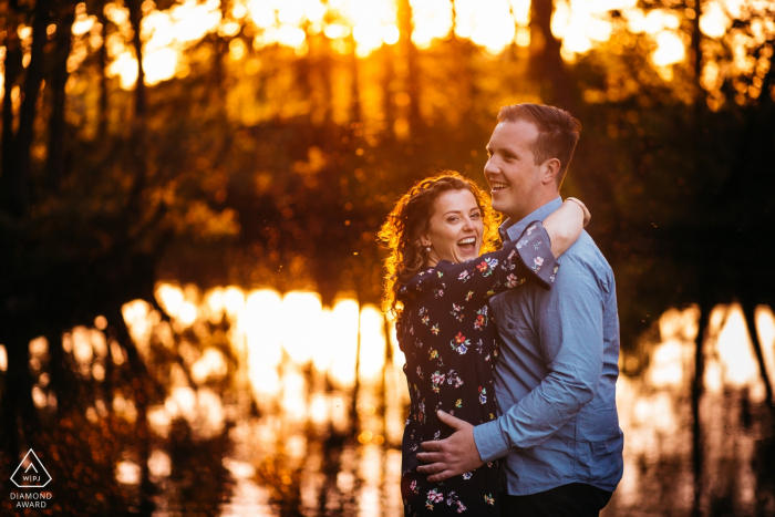 happy laughter during the shoot - engagement photography at sint-niklaas private territory