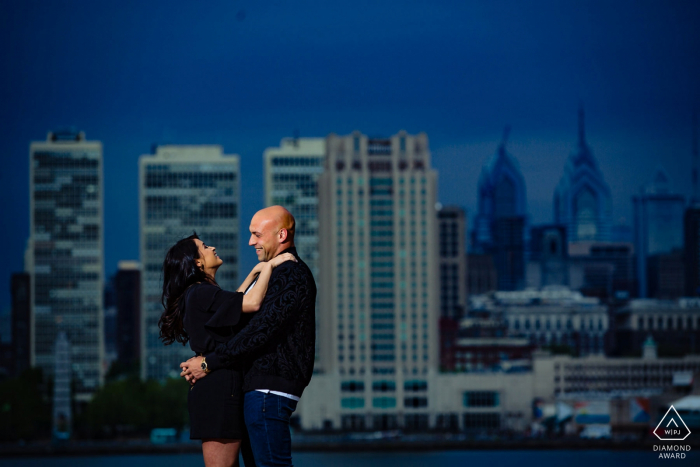 Photo by: <a href="https://www.wpja.com/photos/diamond-award-top-wedding-engagement-photographer/2577085">Miguel Gonzalez - Abington Pennsylvania Camden Waterfront engagement portrait Session - Photographer: Saw the shot, made them laugh.